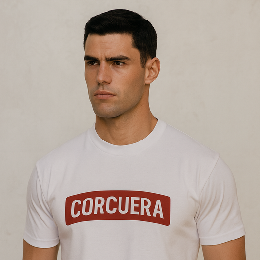 Man wearing a white t-shirt with 'CORCUERA' printed on it against a plain background